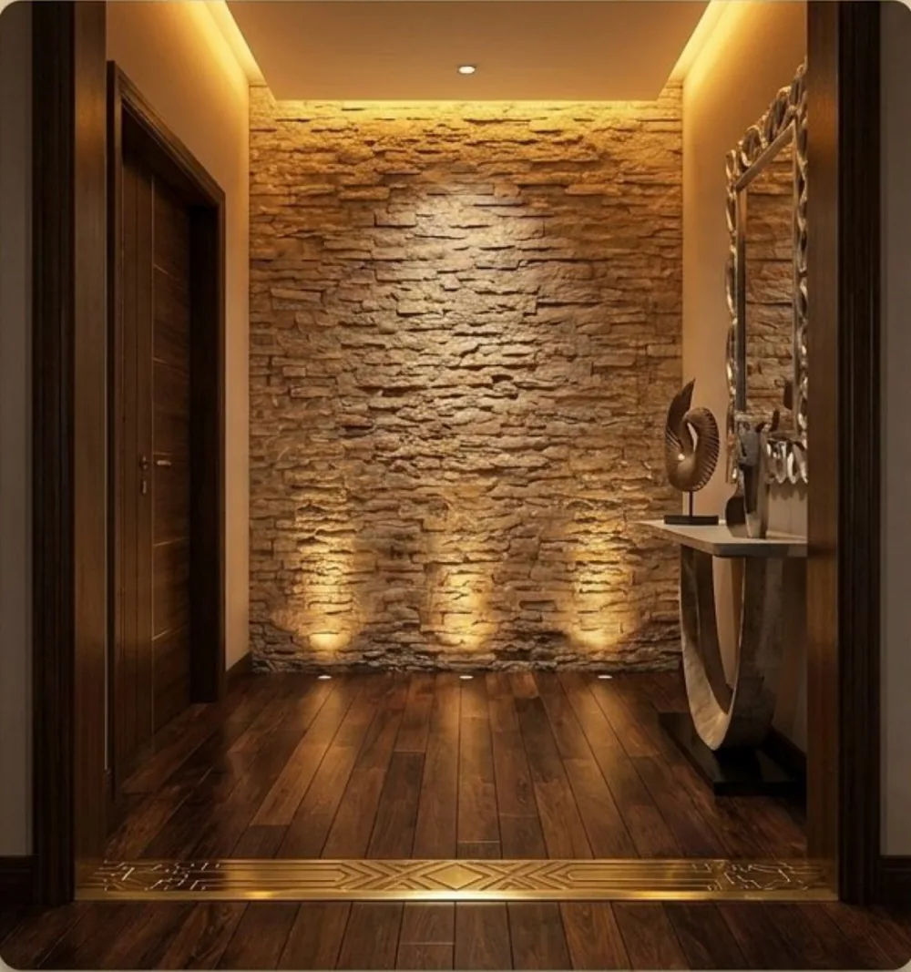 Foyer render from the Unit 02 Vastu analysis: lit stone focal wall and brass threshold